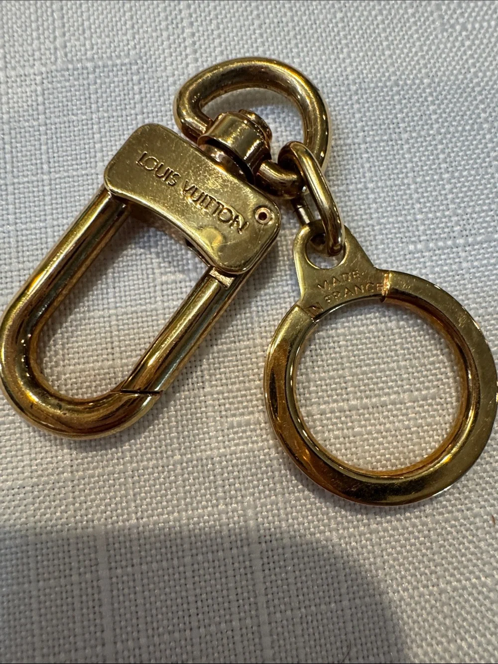 Authentic Louis Vuitton gold-tone key holder